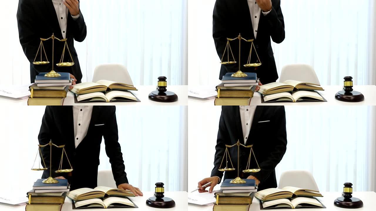 亚洲律师在律师办公室的桌子上准备文件。