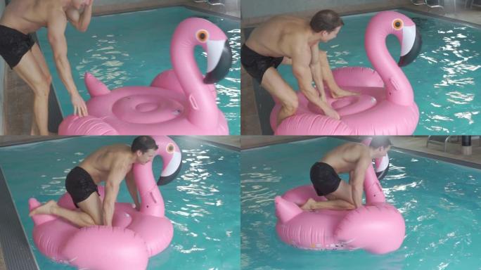 这家伙正试图坐在游泳池里的粉红色火烈鸟上