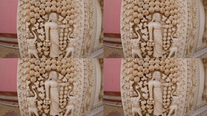 大理石浅浮雕，玫瑰中的女孩形象和elefants Karni Mata Temple特写