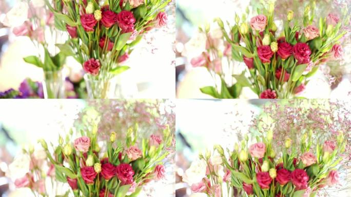 装饰婚礼，桌上有花瓶中的粉色和红色花朵。