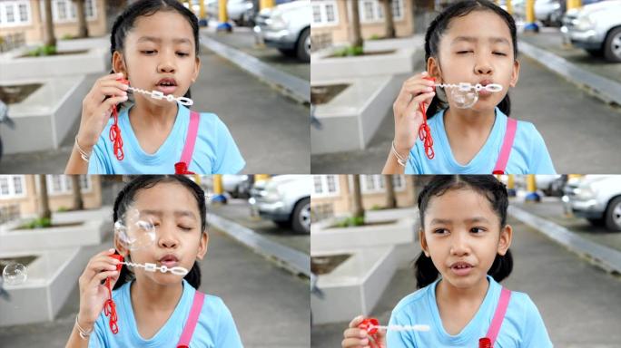 亚洲小女孩玩泡泡气球快乐