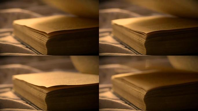 翻开一张旧的老式书籍特写放在平坦的表面上