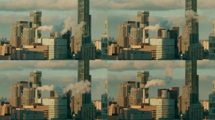 大城市城市景观的延时。蒸汽快速流动的高高的烟囱。