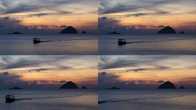日落时在美丽的马来西亚普劳 (Pulau Perhentian) 的水上船