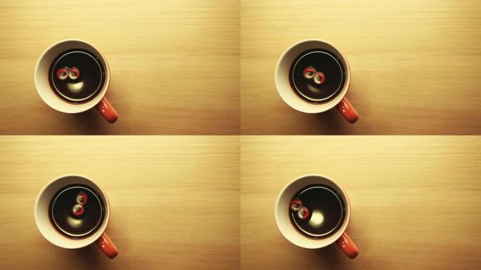 咖啡杯红色塑料眼睛旋转没人木桌高清镜头