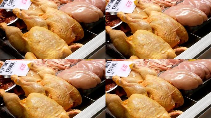 肉店橱窗或柜台上的大鸡尸。