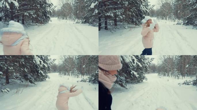 年轻女孩在雪地上奔跑和摔倒。