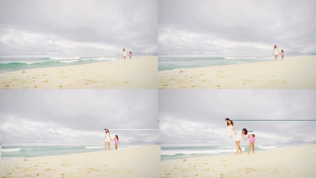 母亲和女儿一起走在海滩上