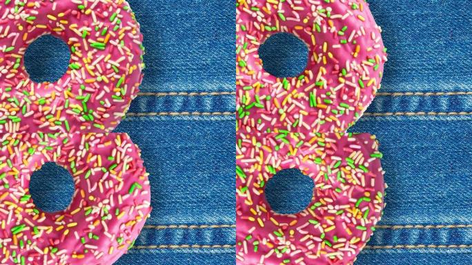 粉色甜甜圈在蓝色牛仔裤背景上旋转