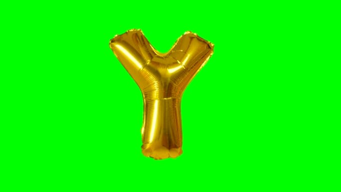 漂浮在绿色屏幕上的字母氦气黄金气球的大字母Y