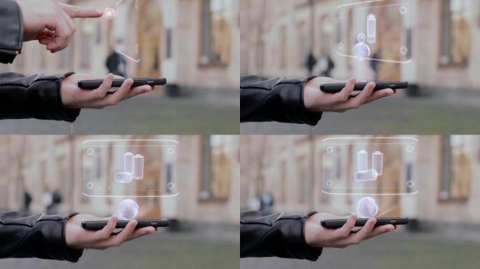 男性手在智能手机上展示概念性平视显示器全息充电电池