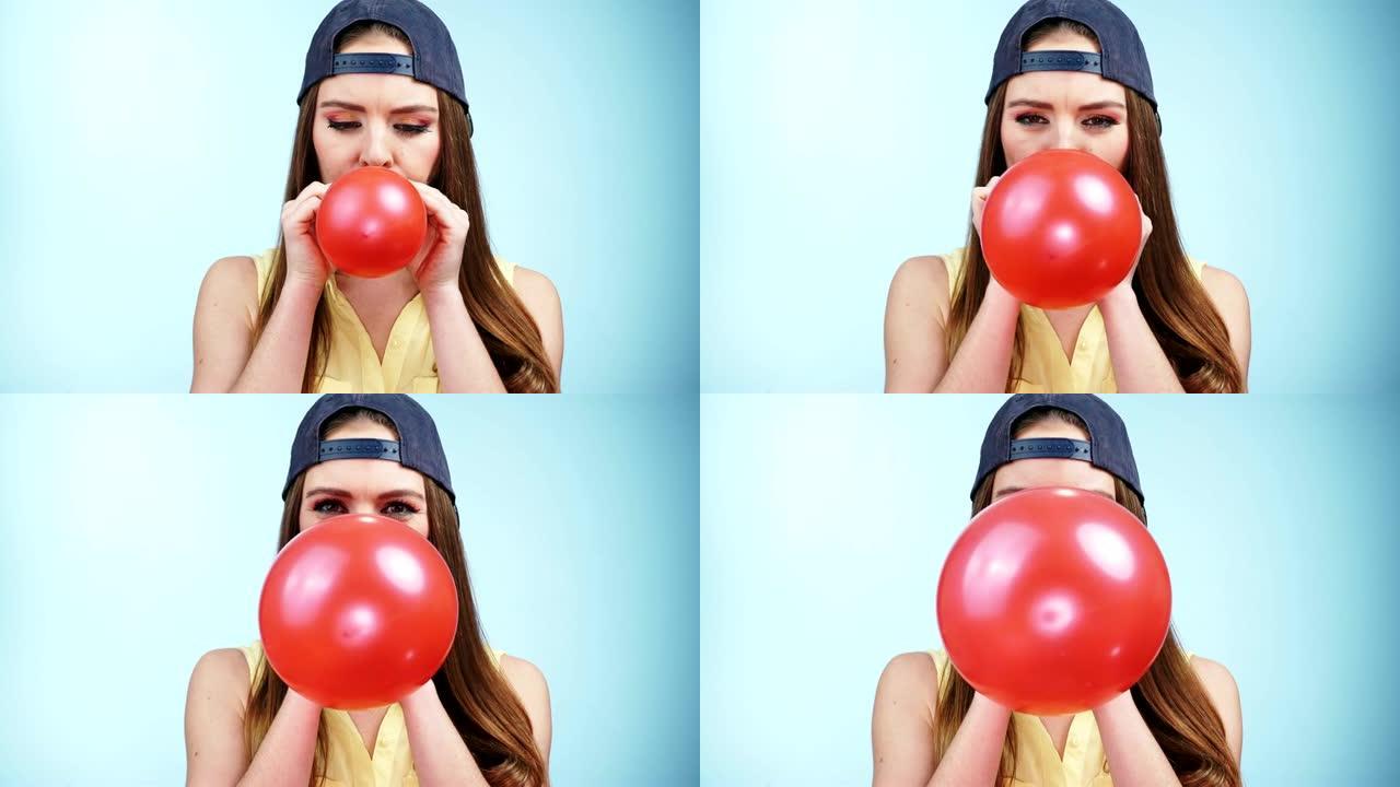 女人休闲风格吹红色气球4K