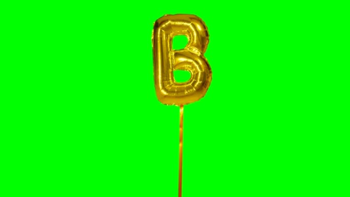 字母B来自漂浮在绿色屏幕上的字母氦气金气球