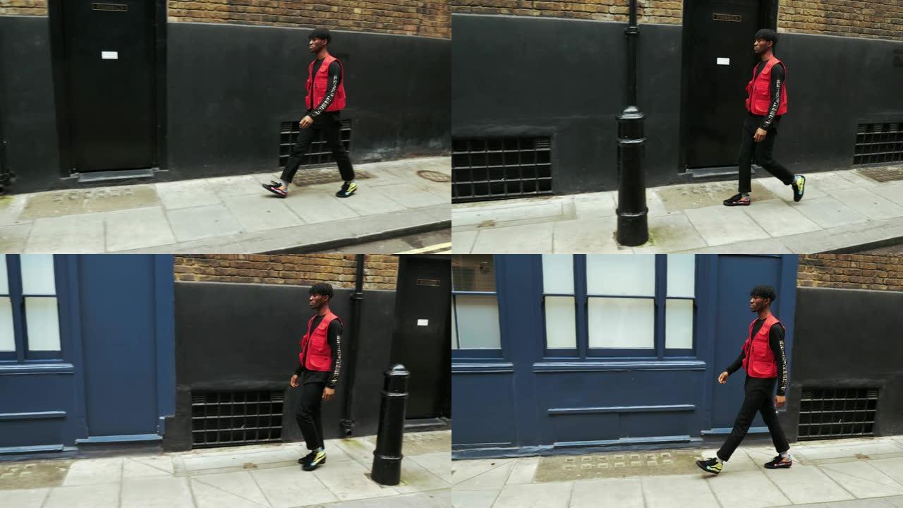 伦敦Z世代男子，穿着红色服装行走