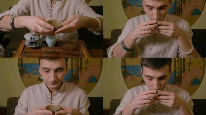 肖像茶大师从碗里喝绿茶，享受风味和味道
