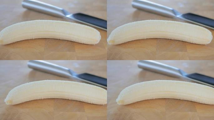 砧板上的香蕉和刀的特写镜头。