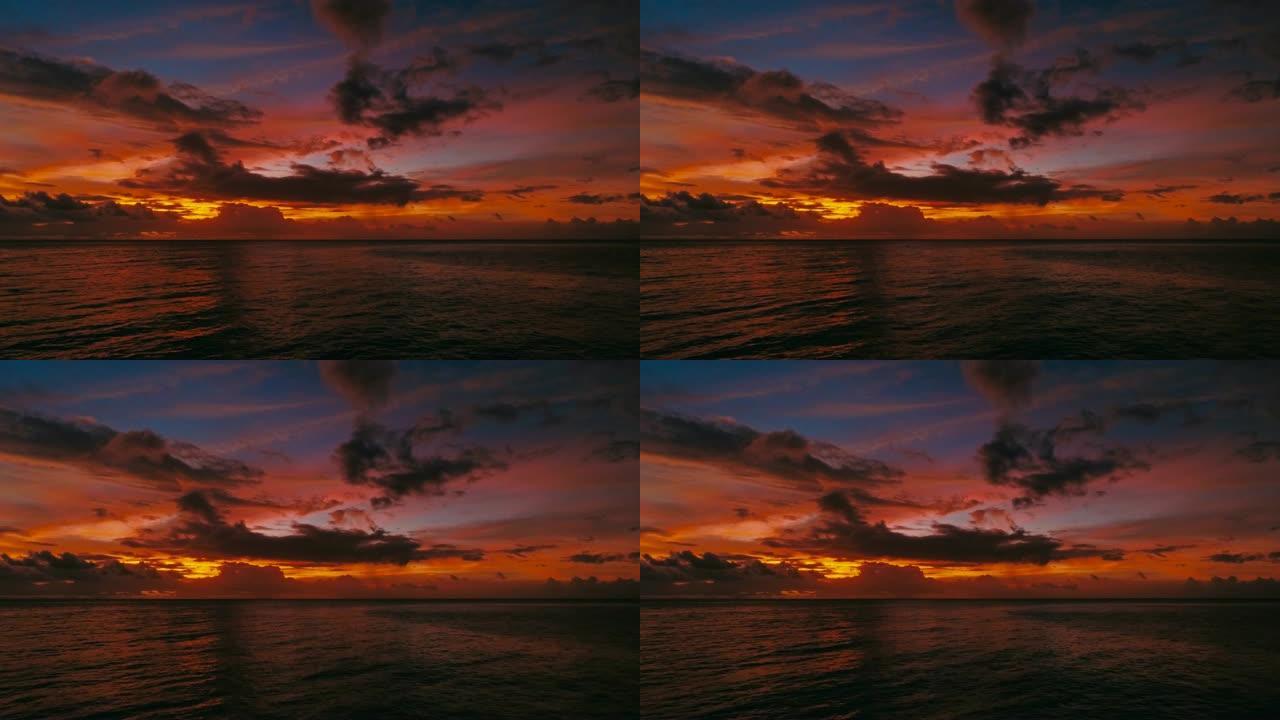 海洋上方红色热带日落的令人惊叹的美丽空中无人机图像