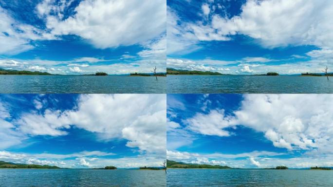 T/L潘风景秀丽的热带岛屿，在蓝天和云移动的湖中
