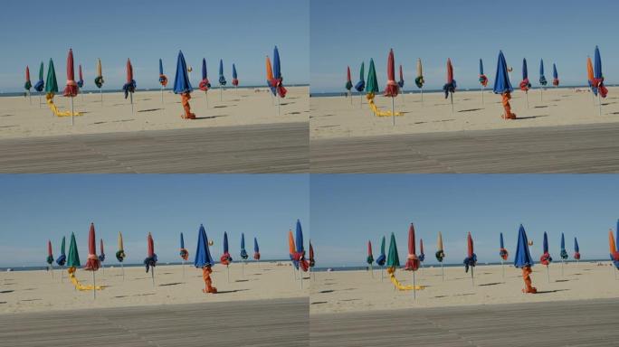 法国海滩上的彩色阳伞防晒慢速盘4K 2160p 30fps超高清镜头-诺曼底多维尔市美丽的一天384