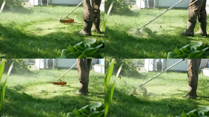 在阳光明媚的夏日，男工人用汽油割草机修剪器用马达割草。在乡下割草。慢动作