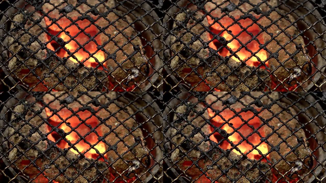 空烧烤热火烤架和燃烧木炭煤块的俯视图