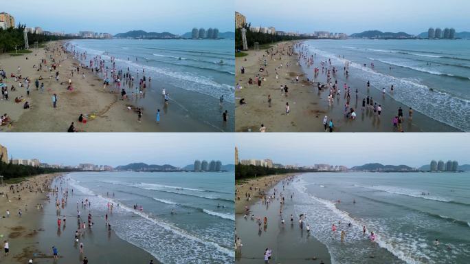 海南省三亚市三亚湾耶梦长廊沙滩上的游客
