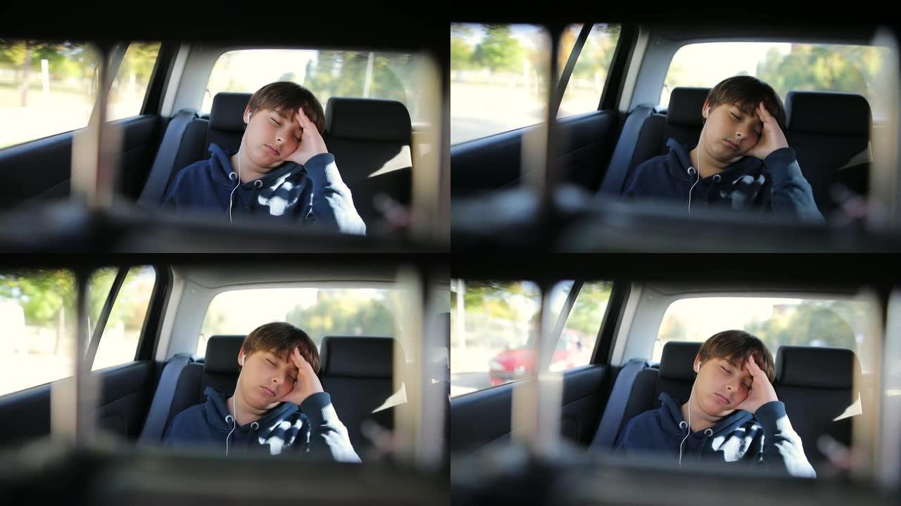 小男孩睡在没有安全带的车里