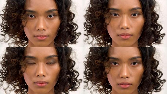 亚洲美丽的棕褐色女人脸上的特写镜头用手白色背景看着相机。拥有美丽、医疗保健、情感概念的人。