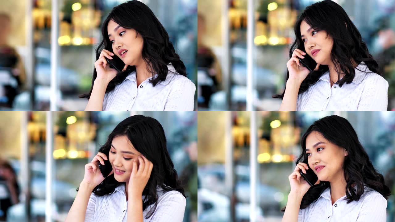 微笑的亚洲女商人使用智能手机聊天中断