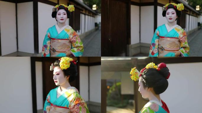 舞子学徒艺妓走在京都Gion的传统街道上