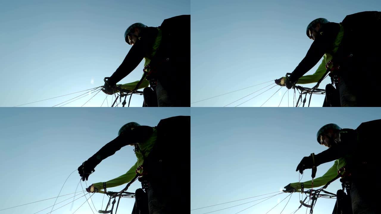 滑翔伞，飞行员准备在日落时从山上的滑翔伞发射点起飞，飞行，专业滑翔伞，背光，系列的一部分