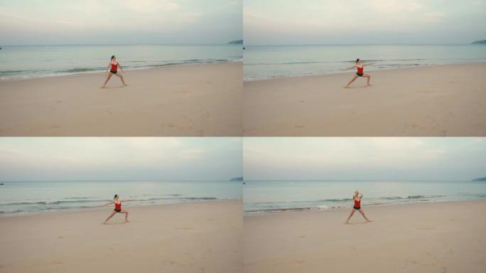 日出前在海滩上练习瑜伽健身运动的女人