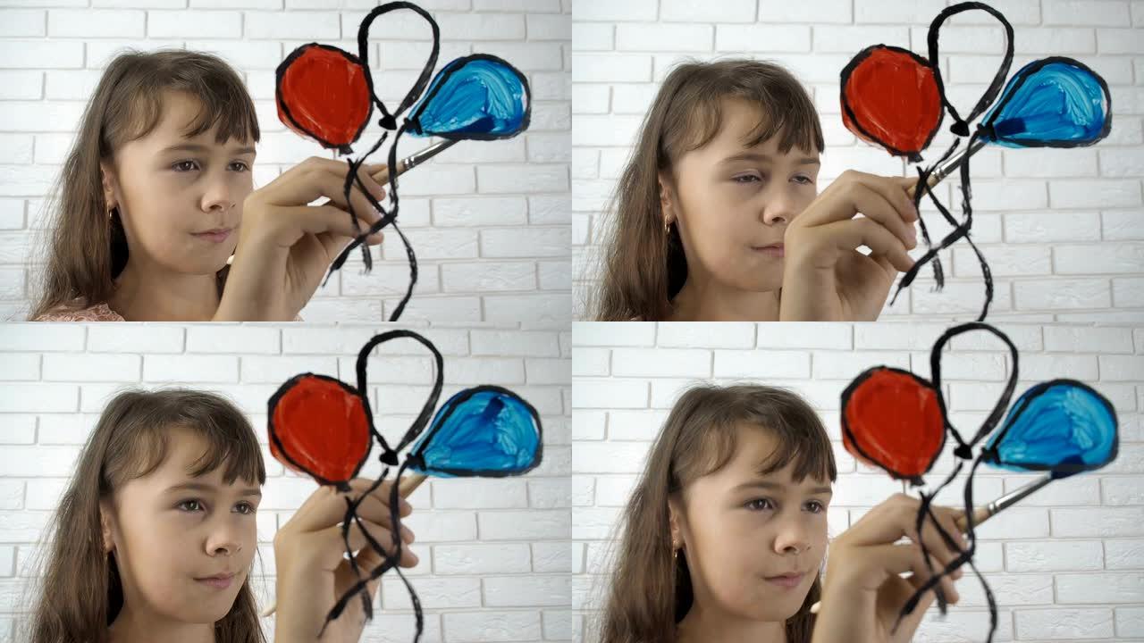小女孩在玻璃上画气球。