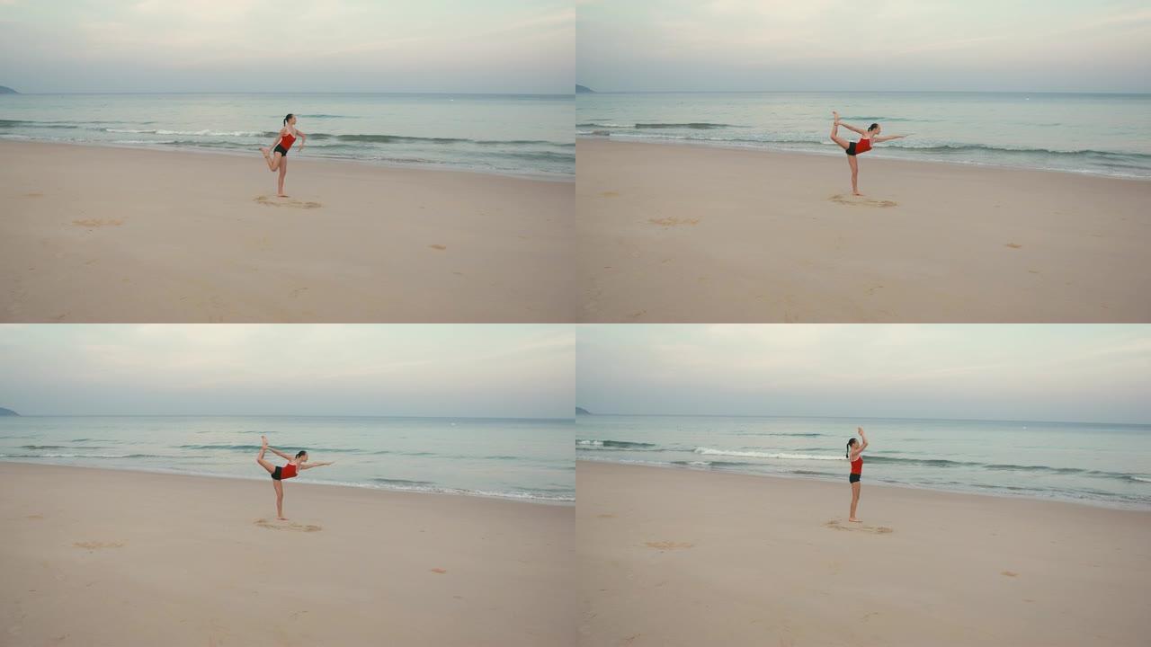 日出前在海滩上练习瑜伽健身运动的女人
