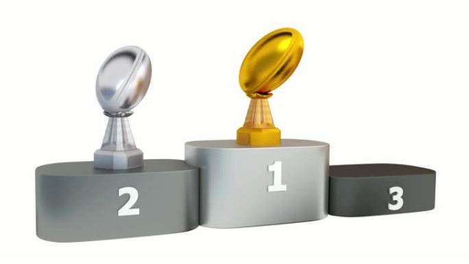 橄榄球金银和青铜奖杯的前视图出现在领奖台上