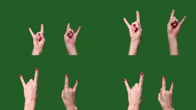 绿屏。Chromakey。手在摇滚音乐会上。角。岩石。