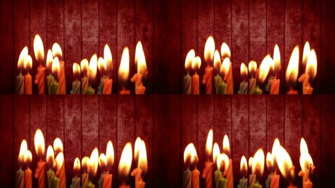 红色木质背景上的生日蜡烛灯