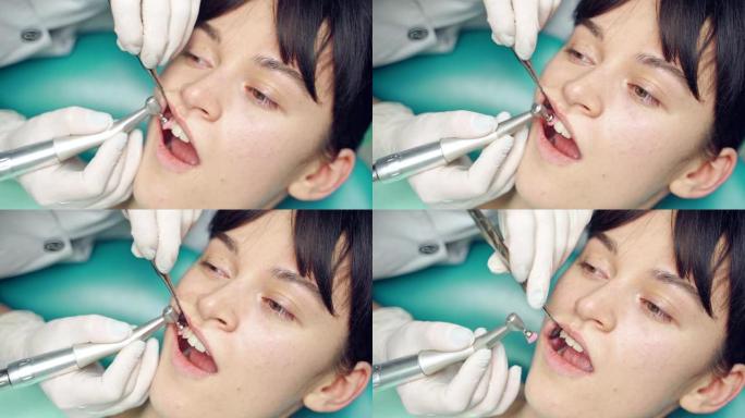 牙医正在牙科中心为客户清除牙齿上的沉积物并美白。