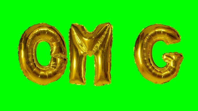 来自漂浮在绿色屏幕上的氦气金气球字母的OMG单词
