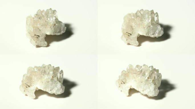 白色背景旋转的石英团簇矿物石材样品