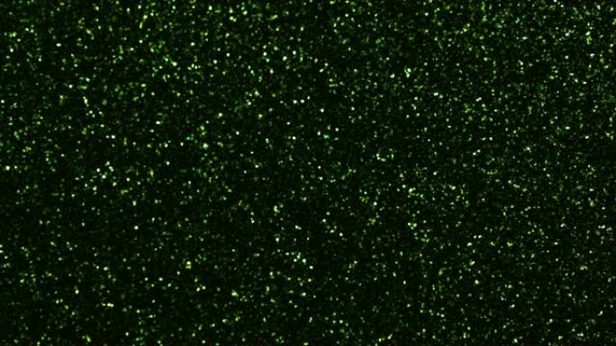 绿色颗粒背景。粒子不同运动的闪光系列。版本3