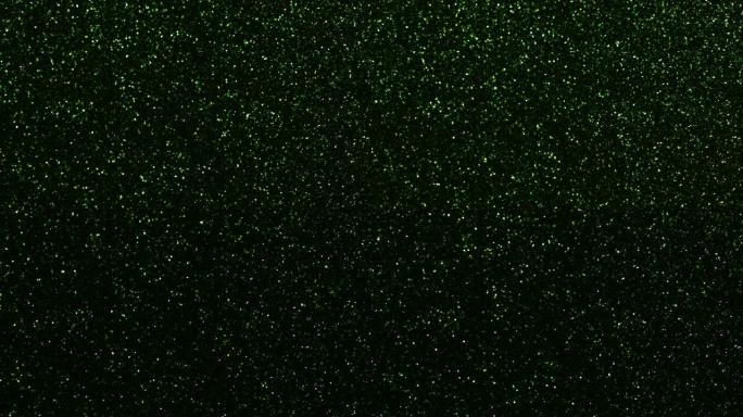 绿色颗粒背景。粒子不同运动的闪光系列。版本3