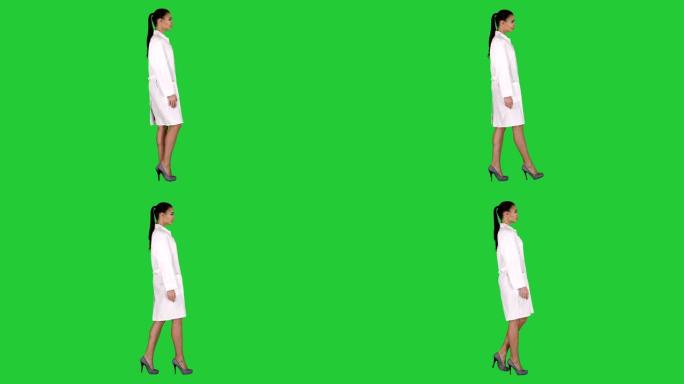 穿着白色长袍的美容师医生在绿色屏幕上行走，色度键