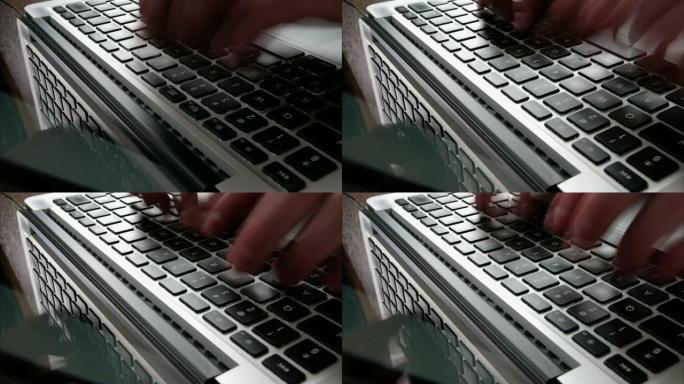 男性手在笔记本电脑键盘上打字时间流逝
