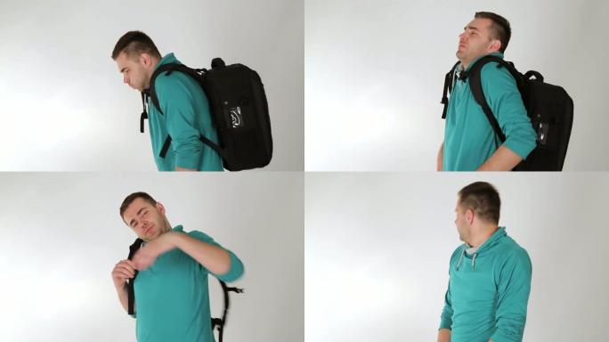 疲惫的年轻人背着背包，背部疼痛，工作室拍摄，白色背景