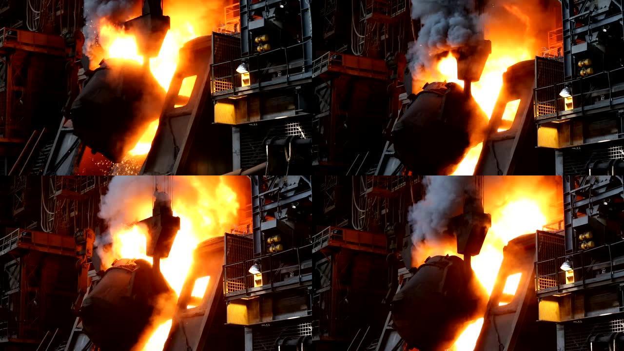将热铁勺倒入容器中。一切都在燃烧。大规模冶金生产。