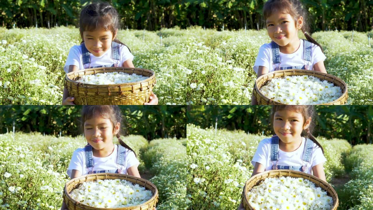 花田里可爱的女孩拿着花篮的特写镜头