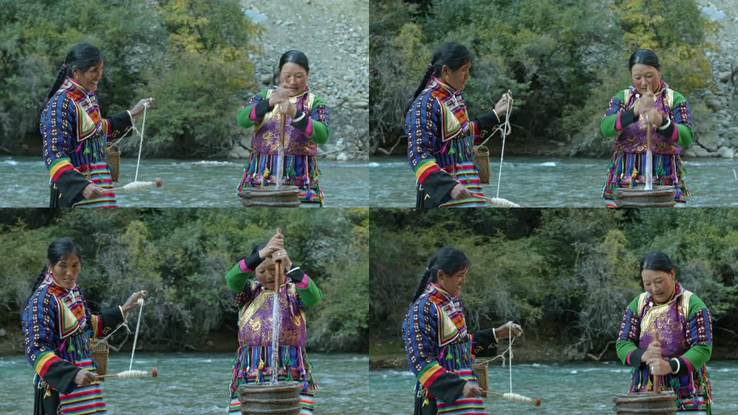 藏族妇女河边纺线织布打酥油茶劳作生活中景