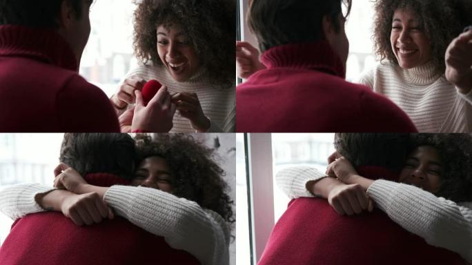 快乐的女人接受戒指并拥抱她的男朋友