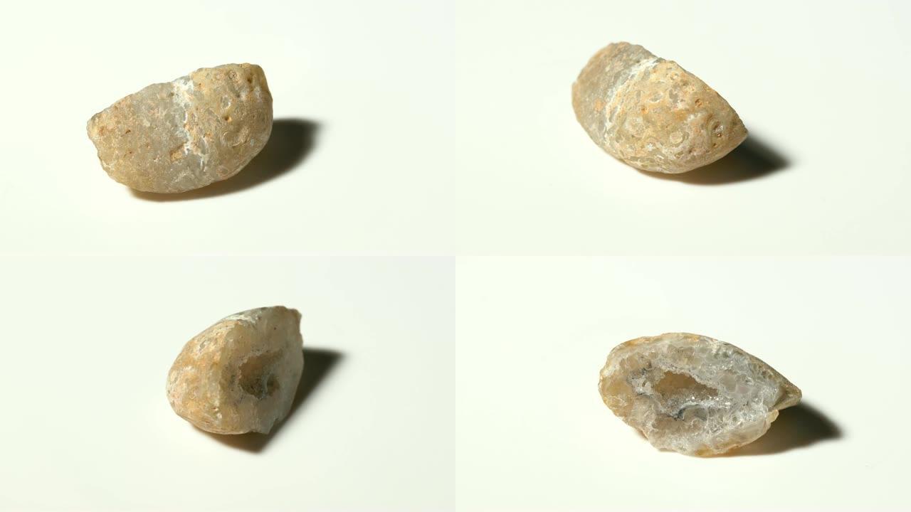 白色背景旋转的玛瑙孔矿石样品